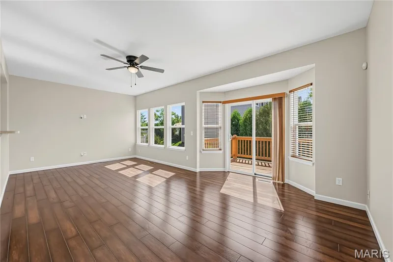 Living Room with 9 Foot Ceilings and Wood Laminate Flooring — 1700 Coupru Court, St Peters, MO 63376