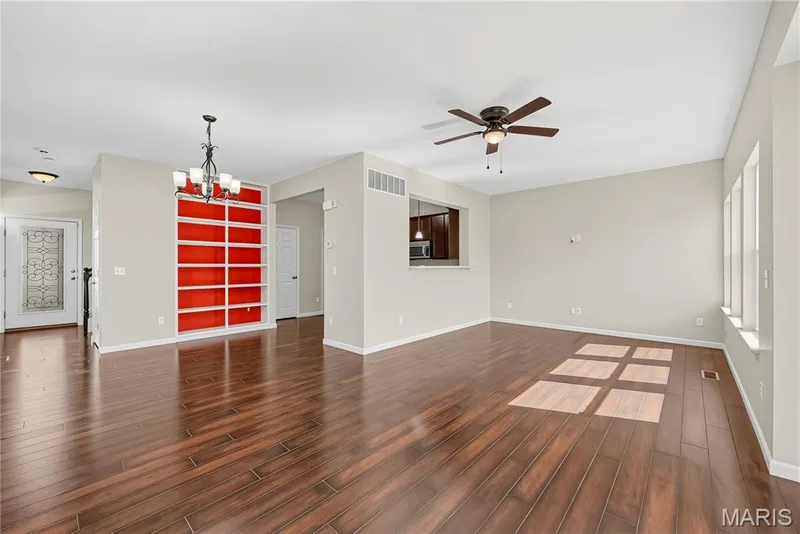 Living Room and Dining Area with 9 Foot Ceilings and Wood Laminate Flooring — 1700 Coupru Court, St Peters, MO 63376