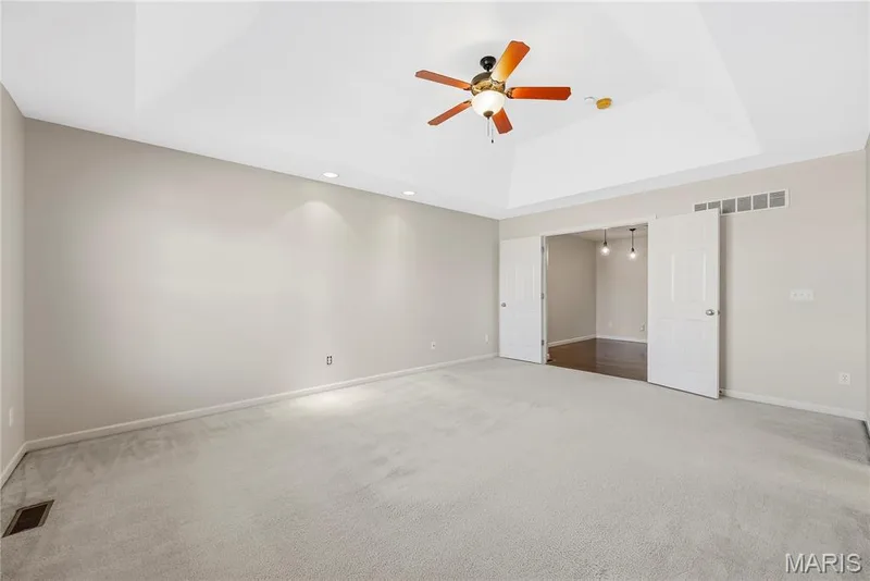 Primary Bedroom Suite with Double Door Entry and Coffered Ceiling — 1700 Coupru Court, St Peters, MO 63376