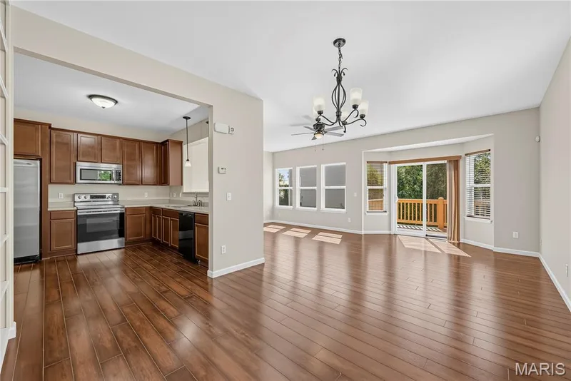 Dining Area with 9 Foot Ceilings and Wood Laminate Flooring — 1700 Coupru Court, St Peters, MO 63376