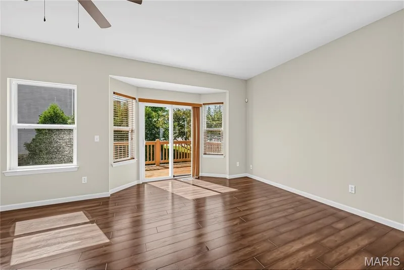 Bay Window with Sliding Glass Door Opening to Deck — 1700 Coupru Court, St Peters, MO 63376