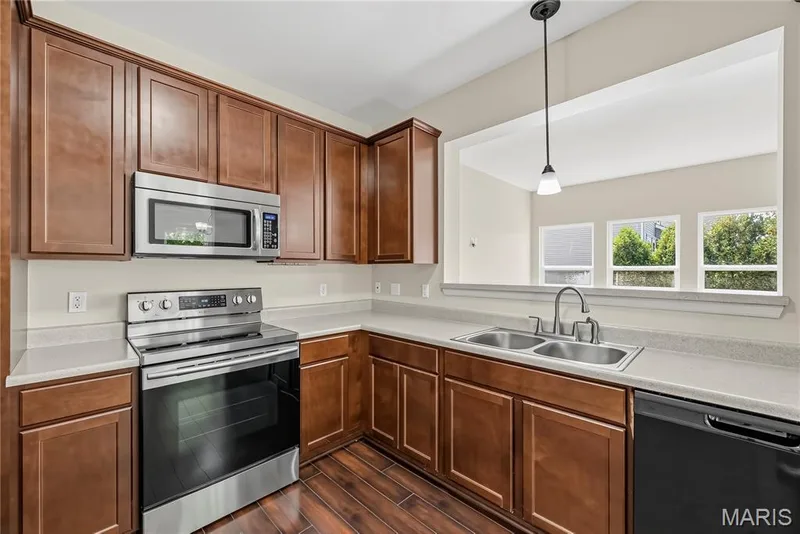 Smooth Top Range and above the Range Microwave in Kitchen — 1700 Coupru Court, St Peters, MO 63376