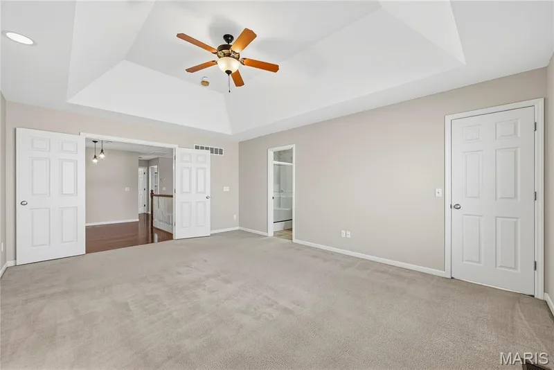 Primary Bedroom Suite with Coffered Ceiling and Double Door Entry — 1700 Coupru Court, St Peters, MO 63376