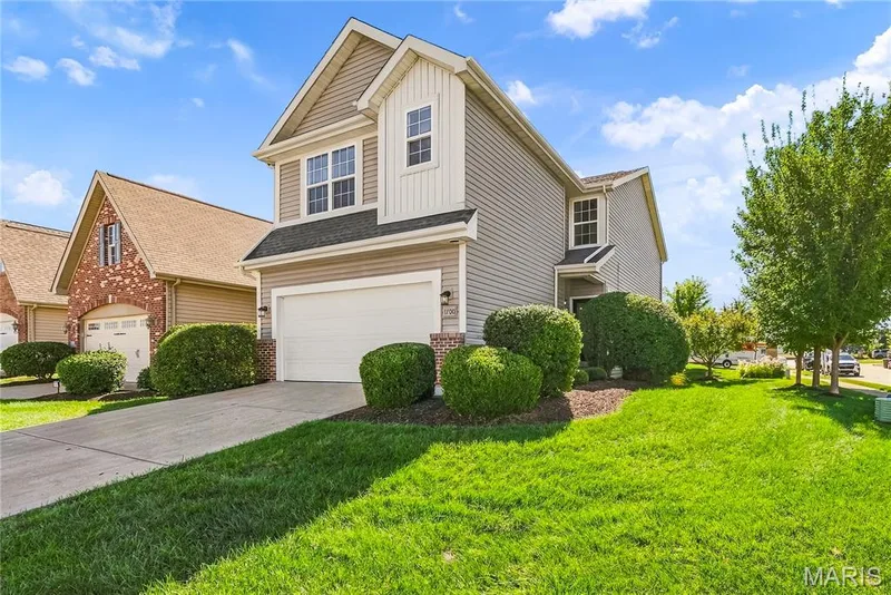 Side Elevation with Professional Landscaping and Mature Shrubs — 1700 Coupru Court, St Peters, MO 63376