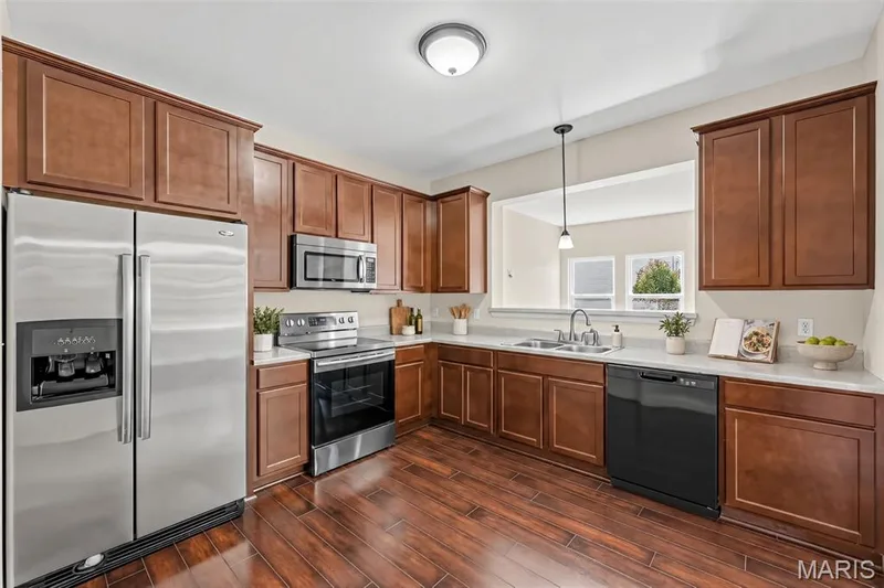 Virtually staged picture of the Kitchen — 1700 Coupru Court, St Peters, MO 63376