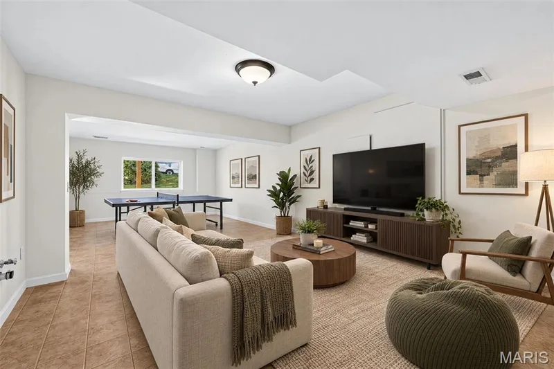 Virtually staged photo of the lower level Recreation Room — 1700 Coupru Court, St Peters, MO 63376