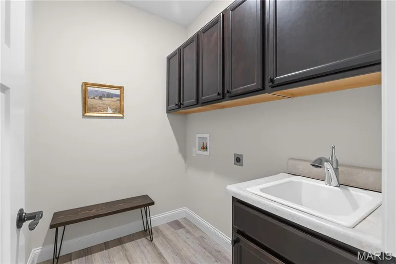 Main level laundry with custom cabs and utility sink conveniently located for ease of chore. — 89 Alta Mira Court, Dardenne Prairie, MO 63368