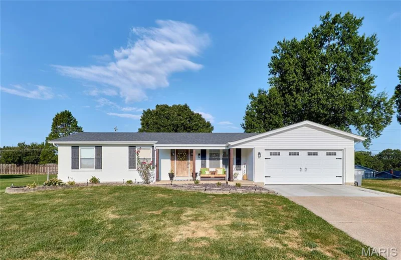 White exterior with black shutters and a gray shingle roof — 415 Westridge Drive, O'Fallon, MO 63366