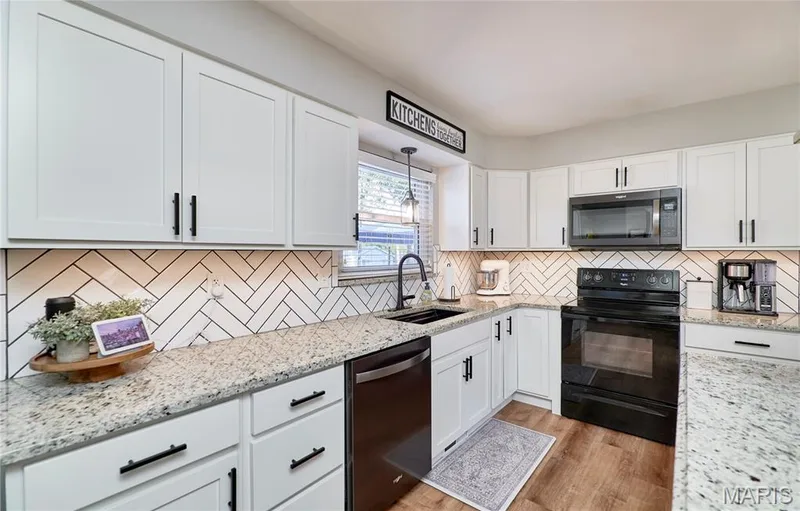 White shaker cabinetry with matte black hardware — 415 Westridge Drive, O'Fallon, MO 63366