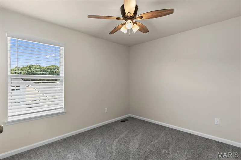 Neutral-toned walls complement the gray carpet flooring — 211 Brookview Way Court, O'Fallon, MO 63366