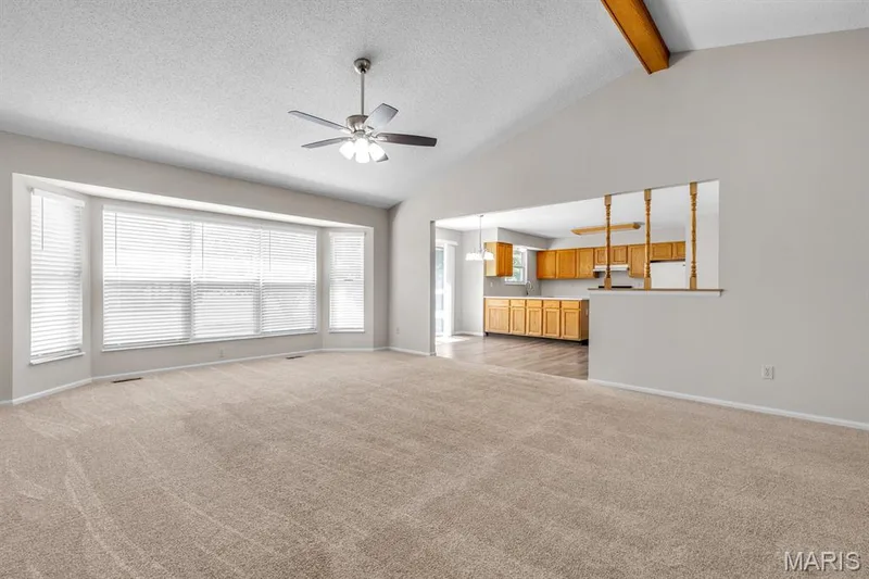 Large greatroom with 5 bay window and 2 year old carpeting — 882 Sara Beth Court, St Peters, MO 63376