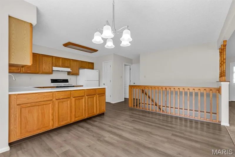View 3 of breakfast room showing open stairwell to the finished lower level — 882 Sara Beth Court, St Peters, MO 63376