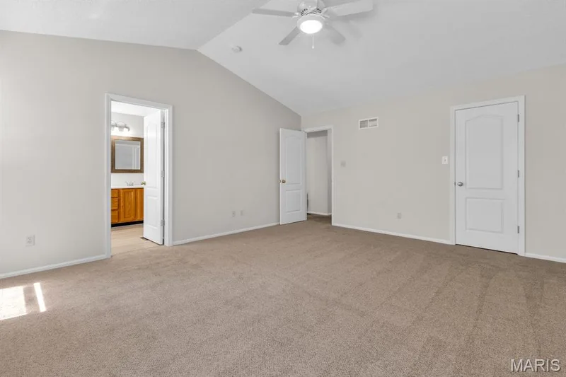 Spacious primary bedroom features brand new carpet — 882 Sara Beth Court, St Peters, MO 63376