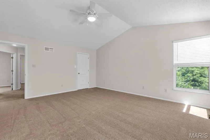 Primary bedroom has vaulted ceiling & walk in closet — 882 Sara Beth Court, St Peters, MO 63376