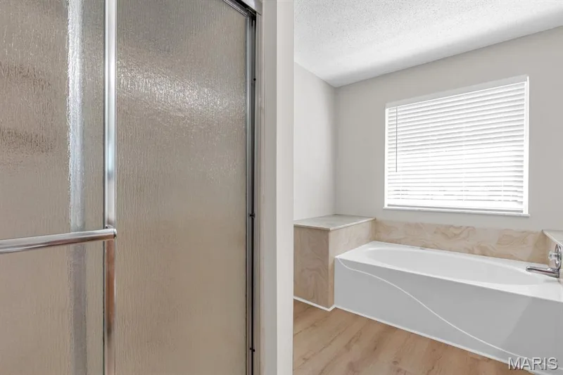 Primary bath separate shower and jetted bath tub — 882 Sara Beth Court, St Peters, MO 63376
