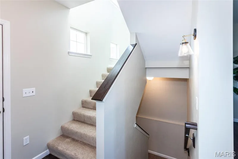 Sun lit split stairs. — 21 Meadow Vista Court, St Peters, MO 63376