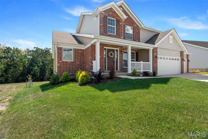 Brick and siding exterior with a covered porch — 337 White Orchid Court, Wentzville, MO 63385
