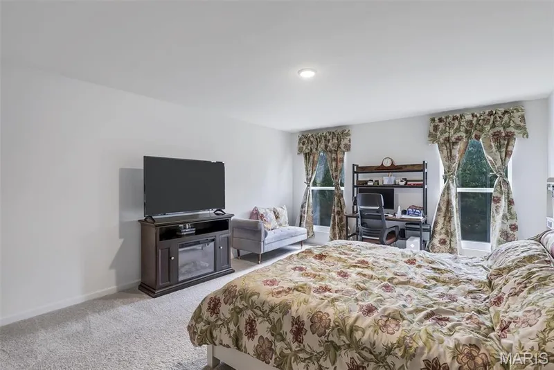 Recessed ceiling lighting, two windows with valances, and light gray wall-to-wall carpeting — 337 White Orchid Court, Wentzville, MO 63385