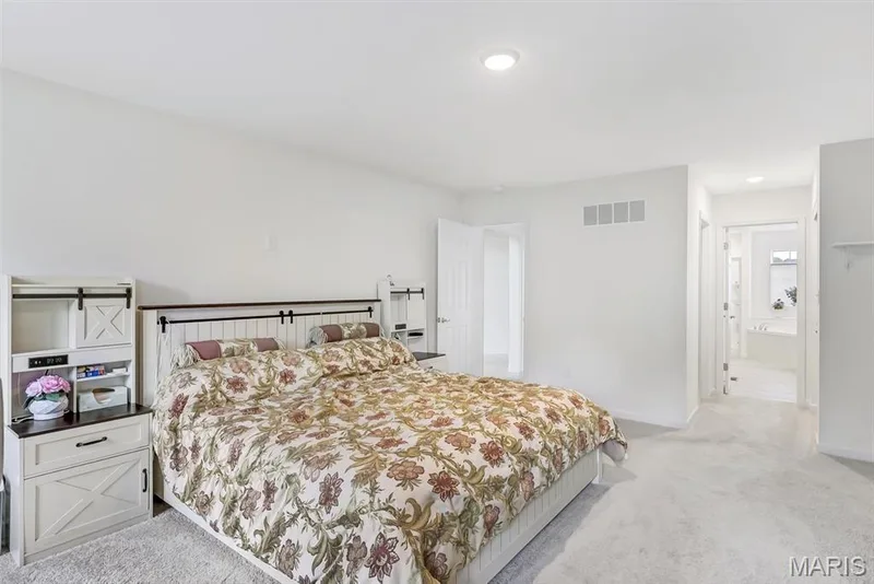 Recessed ceiling lighting, white carpeting, and a white interior door — 337 White Orchid Court, Wentzville, MO 63385