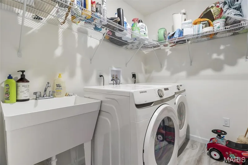 Utility sink, washer and dryer hookups, and integrated wire shelving — 337 White Orchid Court, Wentzville, MO 63385