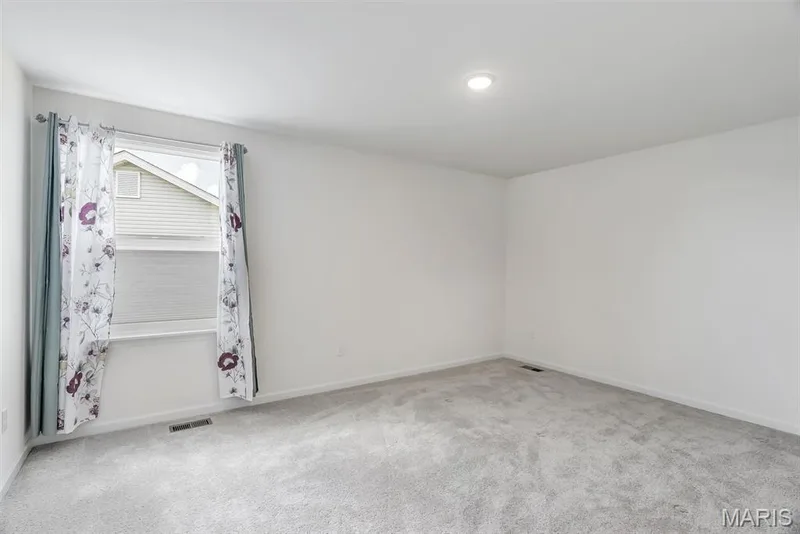 Recessed ceiling light, neutral wall paint, and gray carpeting — 337 White Orchid Court, Wentzville, MO 63385