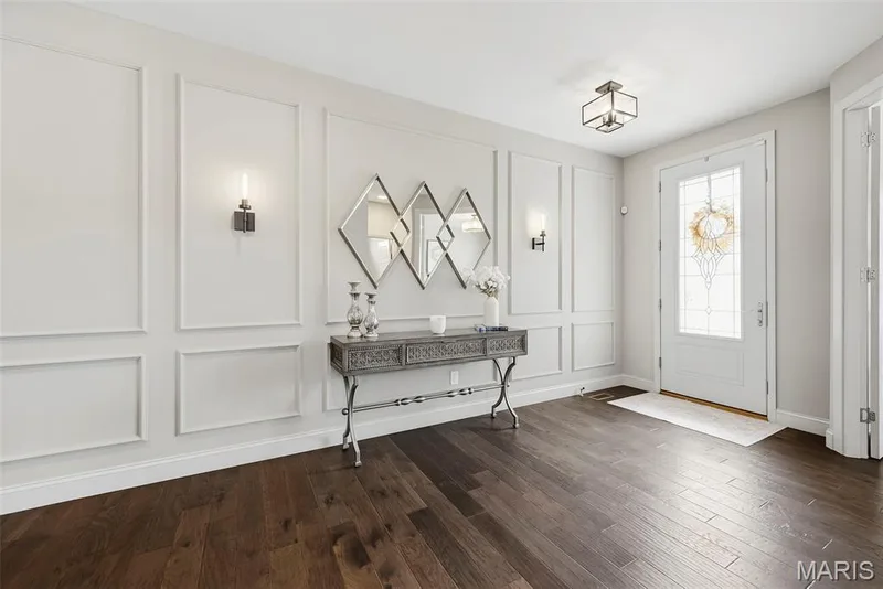 Beautiful foyer with lots of natural light and custom wall design. — 140 Oakleigh Park Lane, St Charles, MO 63303