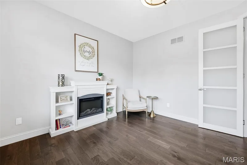 This room is being used as an office with french glass doors carry the natural light through. — 140 Oakleigh Park Lane, St Charles, MO 63303