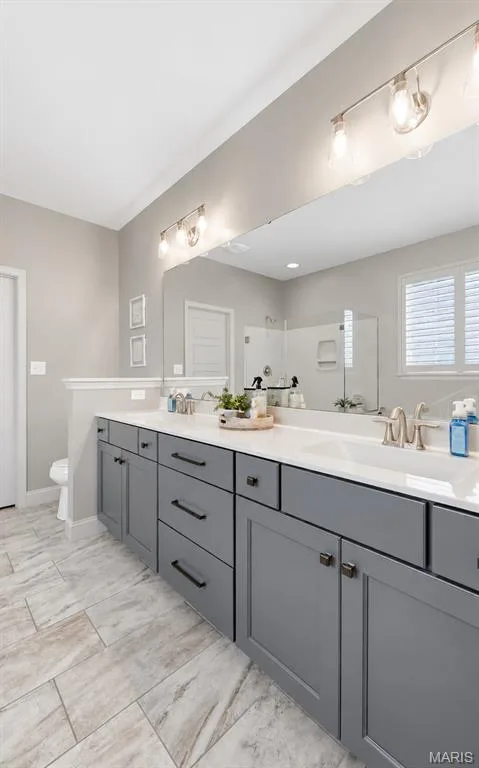 Primary bathroom is elevated with spa like features inviting for relaxation — 140 Oakleigh Park Lane, St Charles, MO 63303
