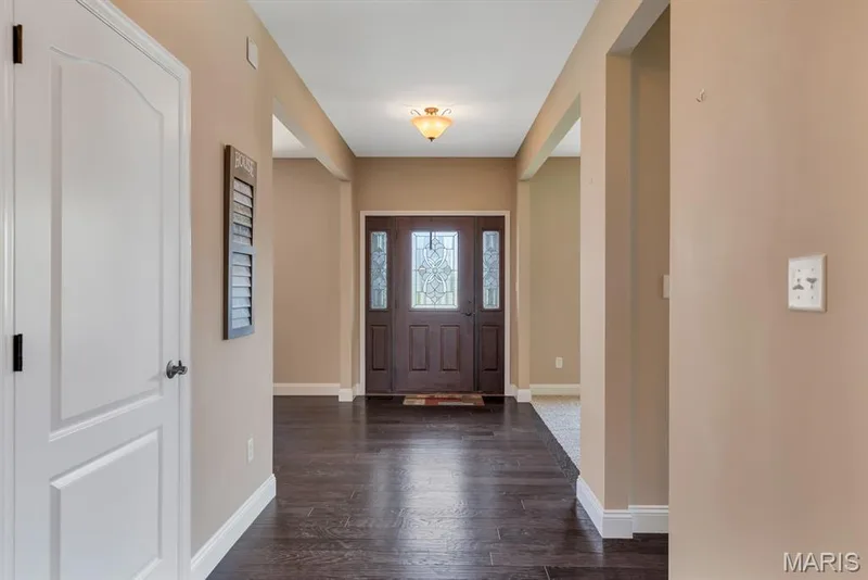 Front Entryway & Hardwood Flooring Throughout Main Level — 221 Oakhurst Circle, O'Fallon, MO 63367