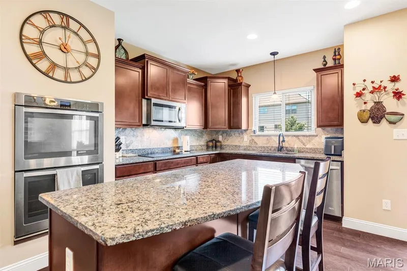 Kitchen Featuring Electric Cooktop & Double Wall Ovens — 221 Oakhurst Circle, O'Fallon, MO 63367