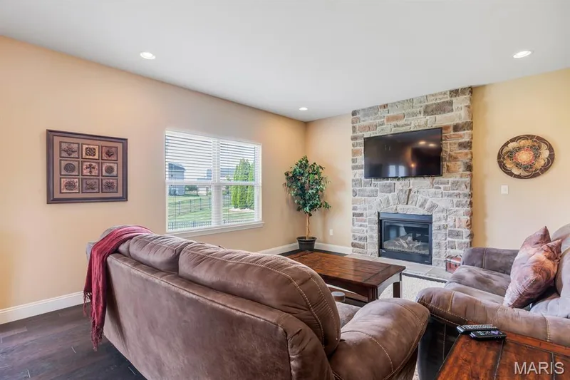 Hearth Room With Brick Masonry Gas Fireplace — 221 Oakhurst Circle, O'Fallon, MO 63367
