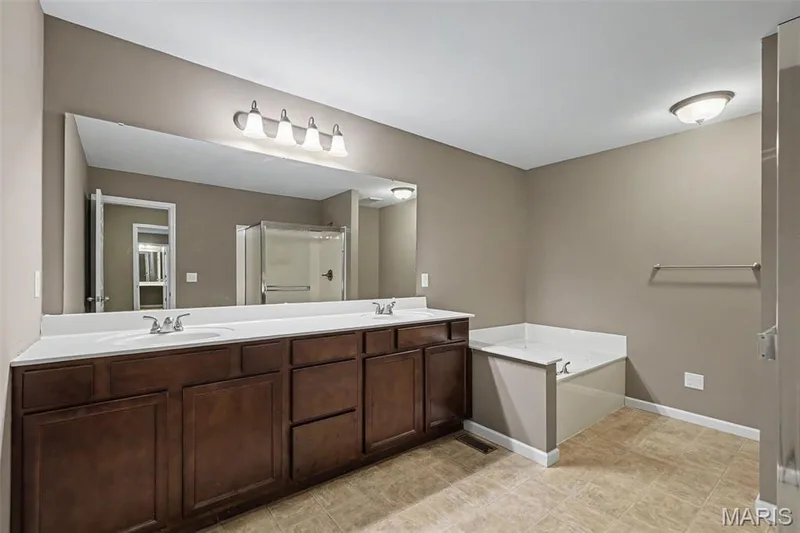 Private bath with double vanity, jetted tub, and separate shower. — 152 Carlton Point Drive, Wentzville, MO 63385