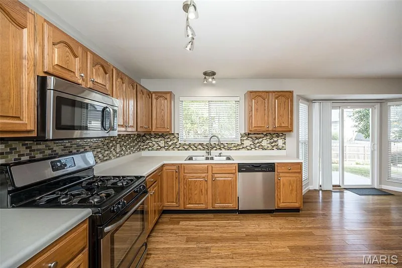 Open kitchen with lots of cabinet and counter space — 2007 Trio Drive, Wentzville, MO 63385