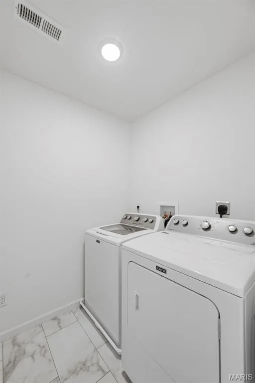 Recessed ceiling lighting, white walls, and white tile flooring with grey veining — 191 Crestfield Court, St Charles, MO 63301