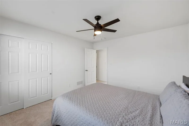 Recessed panel doors, ceiling fan with integrated lighting, and carpet flooring — 191 Crestfield Court, St Charles, MO 63301