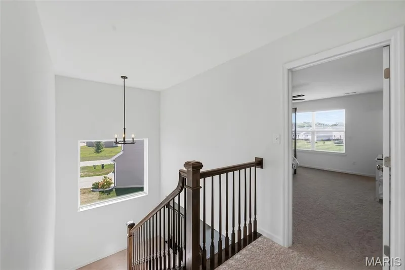 Hallway with large open natural lighted window views — 191 Crestfield Court, St Charles, MO 63301