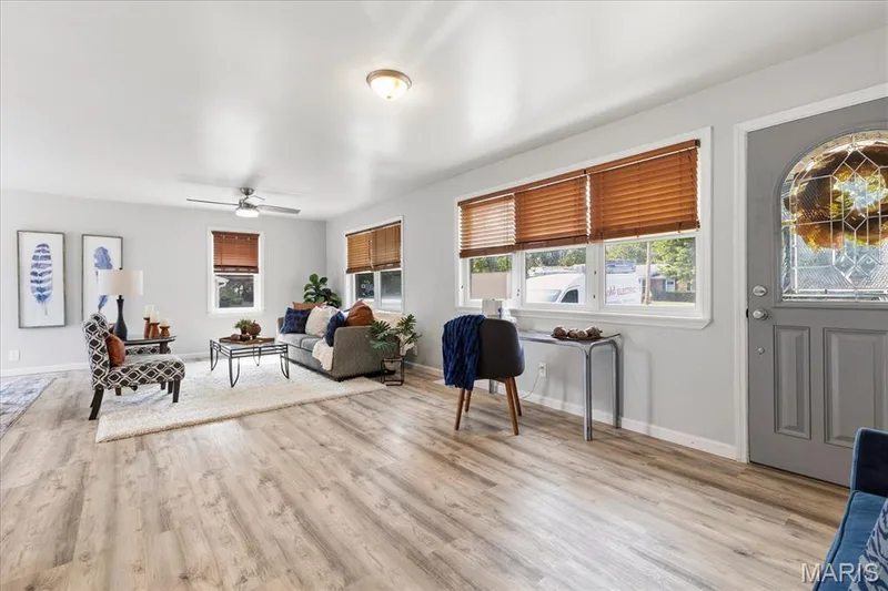 Light-filled comfort with low-maintenance luxury vinyl floors made for everyday living. — 1808 Cherry Tree Street, St Peters, MO 63376