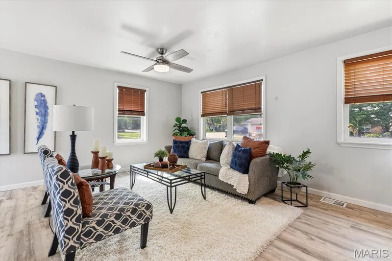 Recessed lighting with a ceiling fan, multiple windows with wood blinds, light-toned walls — 1808 Cherry Tree Street, St Peters, MO 63376
