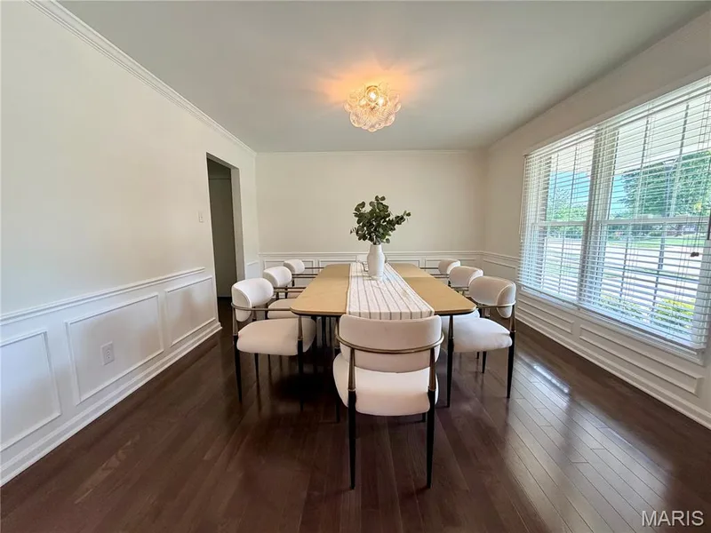 Hardwood flooring, crown molding, chair rail molding, picture frame molding, and a decorative ceiling fixture — 584 Sunbridge Drive, Chesterfield, MO 63017