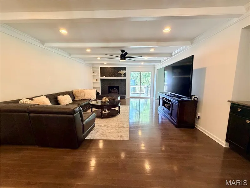 Wood-finish flooring throughout, recessed lighting, and a ceiling fan — 584 Sunbridge Drive, Chesterfield, MO 63017