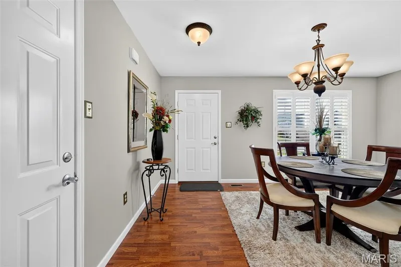 Warm wood-finish flooring complements the neutral wall color — 29 Edenshire Court #69B, Dardenne Prairie, MO 63368