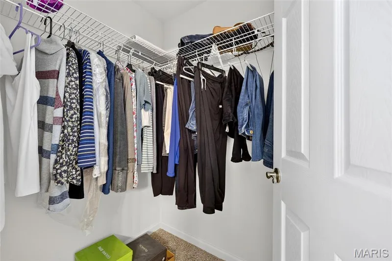 Corner closet with wire shelving and hanging rods — 29 Edenshire Court #69B, Dardenne Prairie, MO 63368