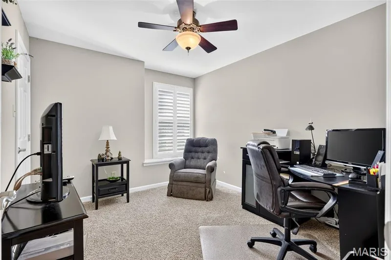 Recessed lighting, ceiling fan light fixture, window with plantation shutters, and light-toned carpeting — 29 Edenshire Court #69B, Dardenne Prairie, MO 63368