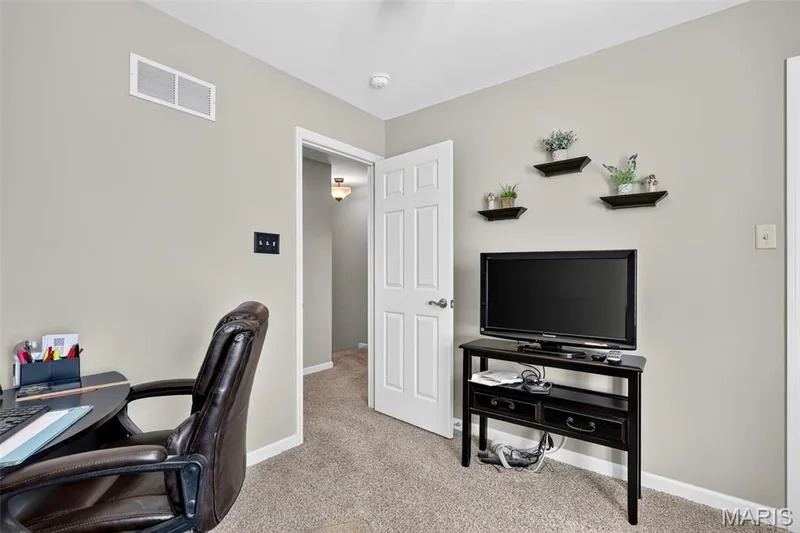 Neutral-toned wall paint, white trim, and light-colored carpet flooring — 29 Edenshire Court #69B, Dardenne Prairie, MO 63368