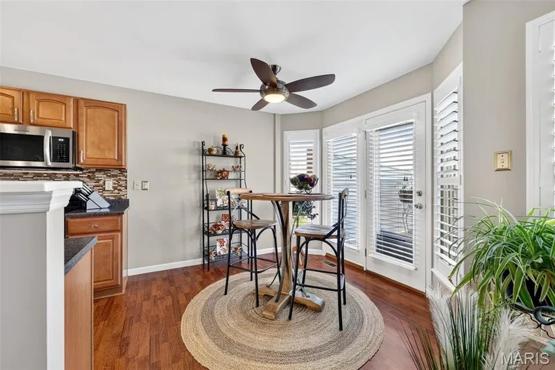 Wood-finish flooring, recessed lighting, and a ceiling fan — 29 Edenshire Court #69B, Dardenne Prairie, MO 63368