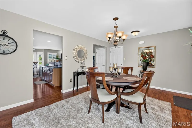 Hardwood flooring throughout, recessed archway, and overhead lighting fixture — 29 Edenshire Court #69B, Dardenne Prairie, MO 63368