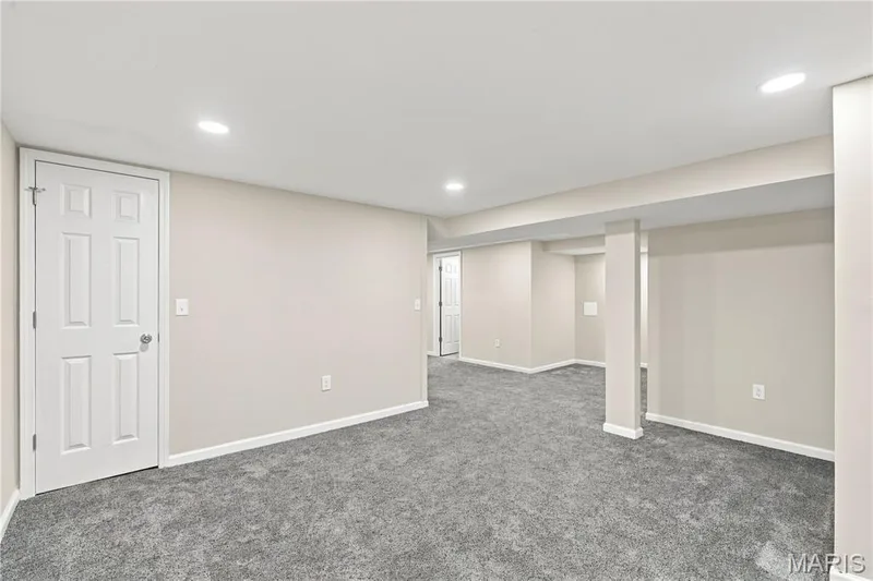 Spacious finished basement with neutral wall finishes, recessed lighting throughout, and plush carpeting — 1620 Dale Avenue, St Charles, MO 63301