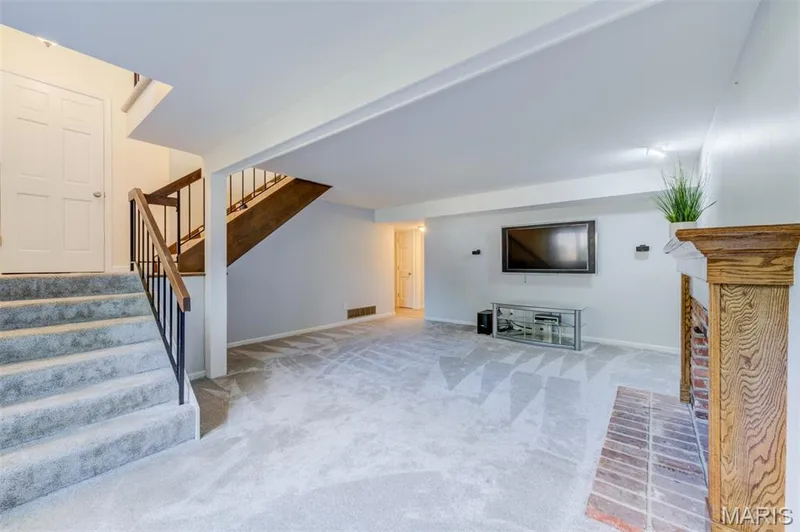 Lower level with wood burning fireplace — 127 Spring Leaf Drive, St Peters, MO 63376