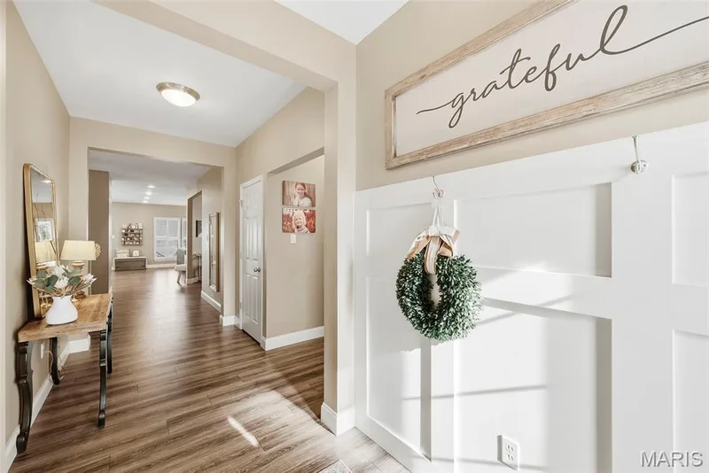 Front entry foyer with wood with board and batten detail — 513 Country Chase Drive, Lake St. Louis, MO 63367