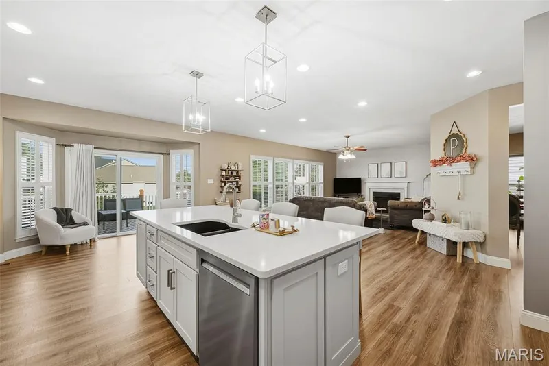 Open floor plan with kitchen transitioning to living room — 513 Country Chase Drive, Lake St. Louis, MO 63367